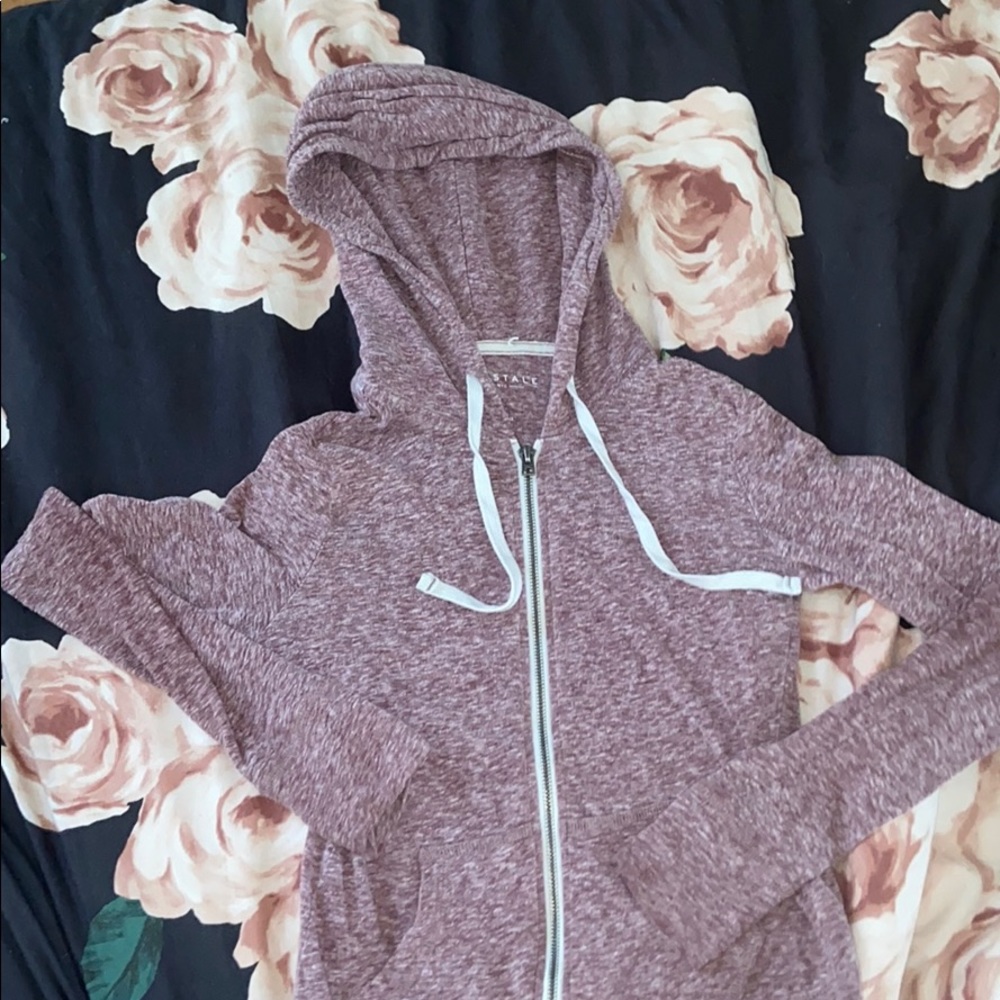 A maroon white speckled zip up jacket!